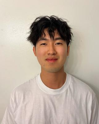 Adam in front of white background