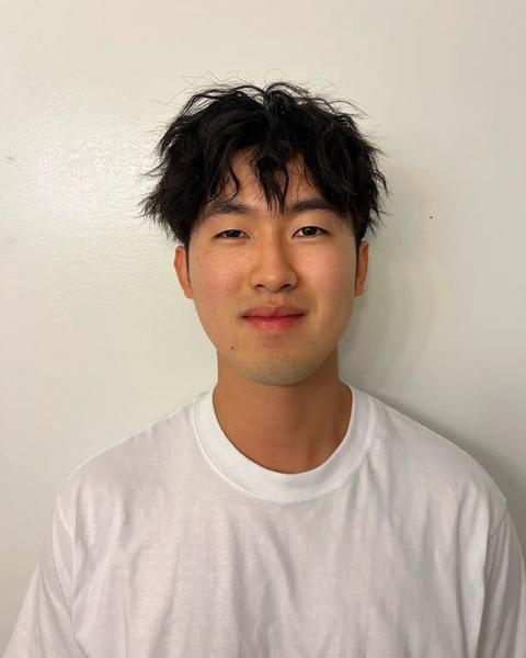 Adam in front of white background